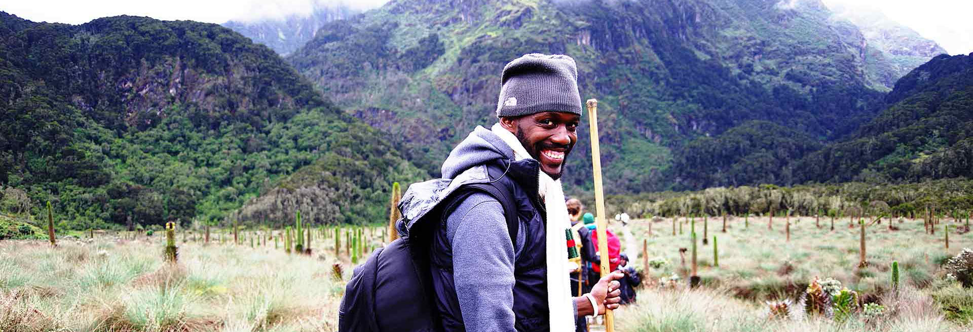 Photo: A hiker in Rwenzori Mountains. Contact Kwezi Outdoors for safaris and tours to Uganda.