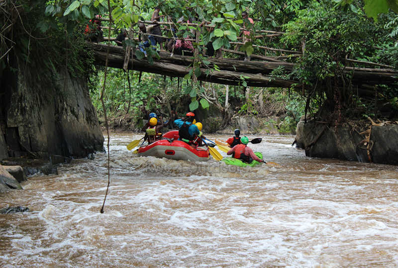 Rafting through community bridges in the Bwindi area - Kwezi Outdoors adventures