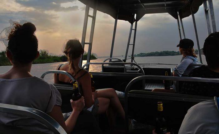 Enjoy a sunset game cruise on the Nile as it leaves Uganda - travel with Kwezi Outdoors